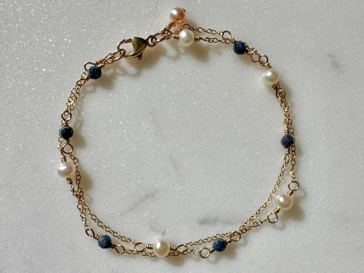 The Anastasia Bracelet in Blue Sapphire with White Freshwater Pearl
